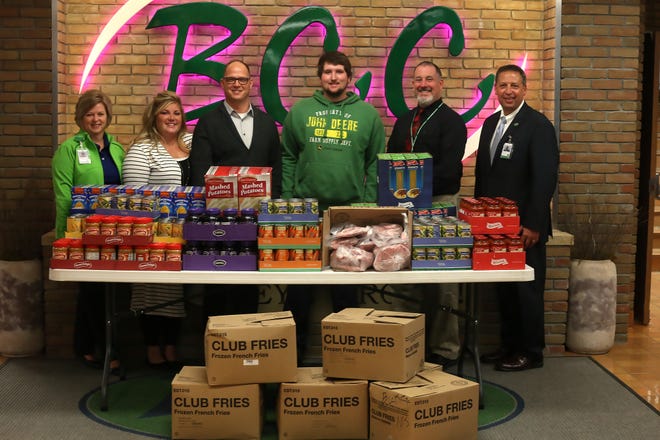 Buckeye Career Center staff recently donated a processed hog and nonperishable food items to Authentic Church in New Philadelphia to benefit the Blessings in a Backpack program. Pictured, from left: Sherry Cardani, Jolene McDonald, Josh McDonald, Brant Horn, Scott Minor and Superintendent Bob Alsept. PHOTO PROVIDED