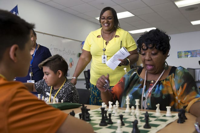 Carolyn White-Mosley, coordinator of the Learning Enrichment Afterschool in Del Valle program at Dailey Middle School, oversees chess class participants Sept. 27. [LYNDA M. GONZALEZ/AMERICAN-STATESMAN]