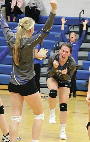 Myra Bolton and her teammates erupted after Ogden clinched a volleyball victory over Madrid on Tuesday. Photo by Andrew Logue/News-Republican