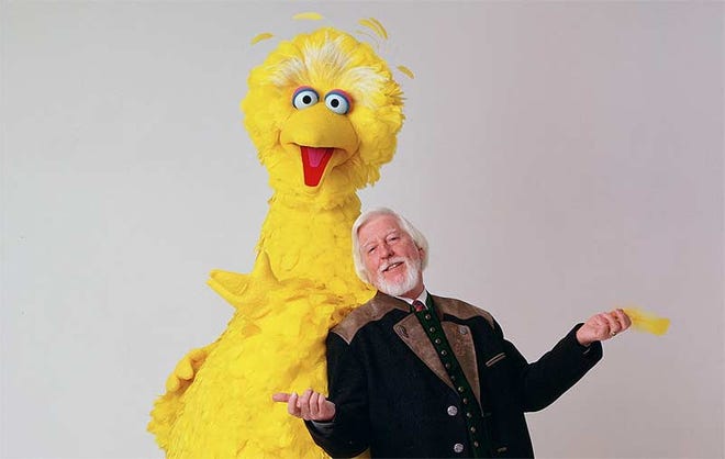 Caroll Spinney, seen right in this 2006 photo, was the puppeteer who played Big Bird and Oscar the Grouch on "Sesame Street" since the show started in 1969. Now 84 years old, Spinney announced that he is retiring Thursday. [File photo]
