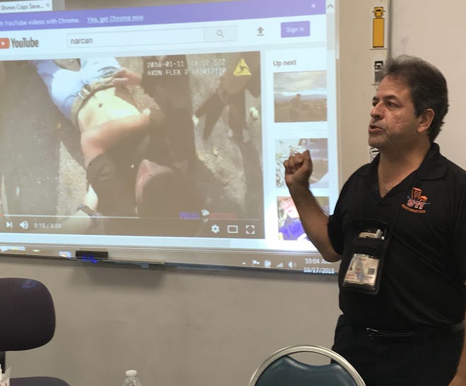 Retired firefighter/paramedic Luis Garcia purchases Narcan in bulk and is traveling the state giving it away and teaching classes about how the spray can help in suspected cases of opioid overdose. Garcia held two classes in Ocala on Wednesday. [Austin L. Miller/Ocala Star-Banner]