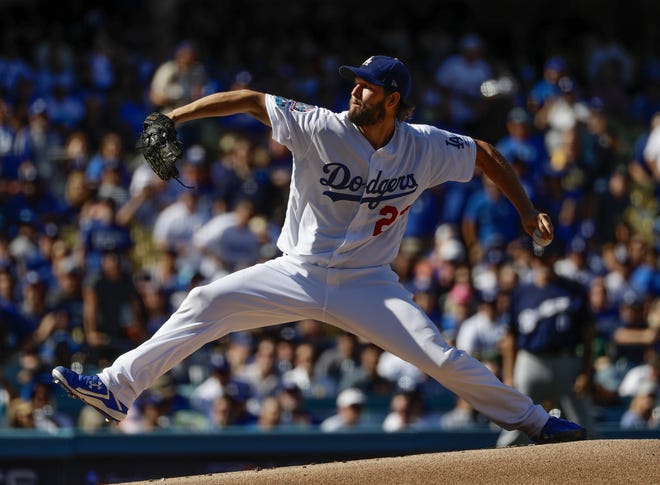 Los Angeles Dodgers starting pitcher Clayton Kershaw throws during the first inning of Game 5 of the National League Championship Series baseball game against the Milwaukee Brewers Wednesday, Oct. 17, 2018, in Los Angeles. (AP Photo/Matt Slocum)
