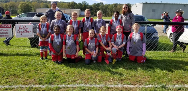 The Dover Soccer Association First Federal Community Bank U10 girls were regular season champions with an undefeated record in the Tri-County Soccer League with a 4-0-2 record. FRONT Ava Garner, Alyvia Herzig, Taylor Vaughan, Miley Patton, Charlee Metcalf and Carleigh Carpenter. MIDDLE Middle: Avery Pierce, Ellen Smith, Ella Wagner, Jenna Molk, Seri Blickensderfer and Alana Garner, BACK Assitant coach Nathan Vaughan and head coach Chelsea Hall. Submitted photo
