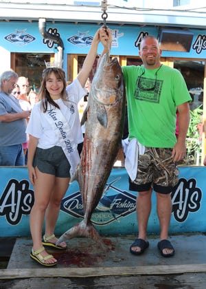 Brian Lowe of Tennessee took over top honors in the Amberjack Division with a 78.6-pound amberjack caught on the Swoop II with Capt. Matt Wheeler. Also pictured is Miss Destin Ellen Brown. [FOR REEL PHOTOS/CONTRIBUTED PHOTO]