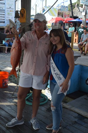 Miss Destin 2018, Ellen Brown, poses for a picture during the 70th Annual Destin Fishing Rodeo. [SHERI KOTZUM/THE LOG]