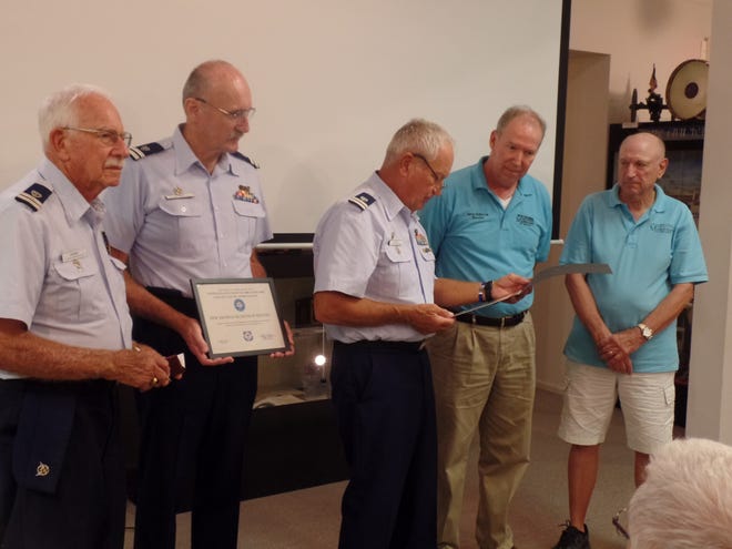 The Coast Guard Auxiliary Flotilla 48 recently presented the New Smyrna Historical Museum with a plaque and certificate recognizing its support of safe boating activities. The museum has hosted several safe boating classes and participates in the Marine Partners program to provide boating information to the public.  Pictured from left, Auxiliarists Harry Munns, Roger Strock and Walt Franek, Director Gary Holbrook and President Greg Swanson. [Photo provided]