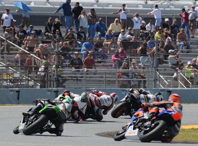 Fans watch the racing action on the infield road course during a recent motorcycle race at Daytona International Speedway. [NEWS-JOURNAL/PETER BAUER]
