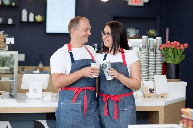 Andrius and Neringa Pranskevicius, the husband-wife owners of B-Noon Coffee & Shop, share a toast after bringing Lithuanian coffee culture to West Palm. [ERICA DUNHILL]