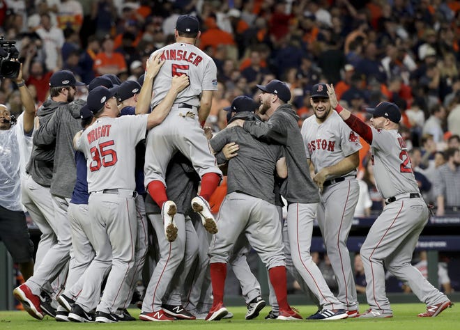 The Boston Red Sox after winning Game 5 of the American League Championship Series against the Houston Astros on Thursday in Houston. The Astros were the defending World Series champions. [DAVID J. PHILLIP/ASSOCIATED PRESS]