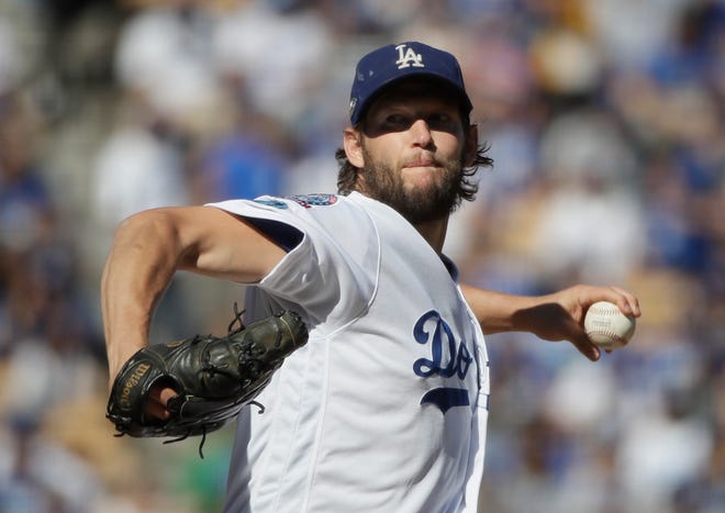 Los Angeles Dodgers starting pitcher Clayton Kershaw throws during the first inning of Game 5 of the National League Championship Series baseball game against the Milwaukee Brewers Wednesday, Oct. 17, 2018, in Los Angeles. (AP Photo/Jae Hong)