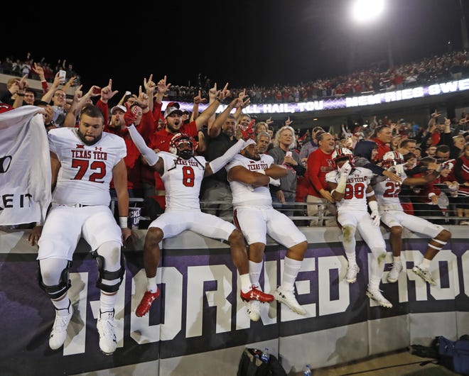 Texas Tech players celebrate with their fans after their 17-14 victory last week at TCU. The Red Raiders, 4-2 and 2-1 in the Big 12, host Kansas on Saturday. [Brad Tollefson/A-J Media]