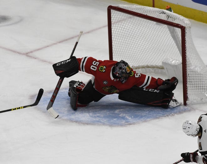 Chicago Blackhawks goaltender Corey Crawford (50) can't make a save on a goal scored by Arizona Coyotes left wing Lawson Crouse during the first period Thursday, Oct. 18, 2018, in Chicago. [DAVID BANKS/THE ASSOCIATED PRESS]