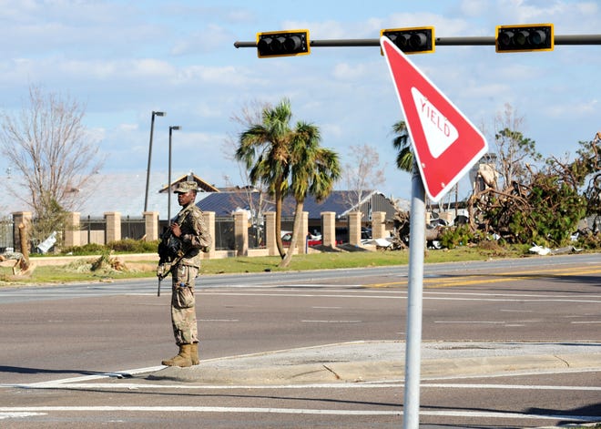 An armed military police officer stands guard at Tyndall Air Force Base on Sunday after Hurricane Michael devastated the base. [CARLOS R. MUNOZ/GATEHOUSE MEDIA FLORIDA]