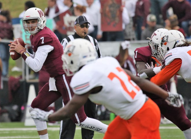 West Texas A&M quarterback Justin Houghtaling (7) rolls out to pass during a game against UT Permian Basin earlier this season. [Tyler Anderson/ Amarillo Globe-News]