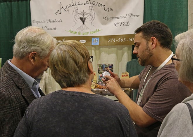 Jason Peters, of Acadia Farms in Rehoboth, discusses the benefits of CBD in a product at the fourth annual Rhode Island Cannabis Convention, on Saturday at the R.I. Convention Center, in Providence. [The Providence Journal / Steve Szydlowski]
