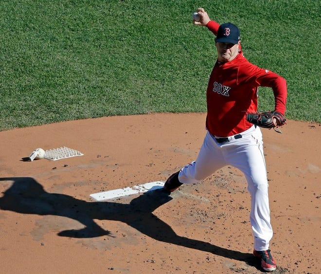 Boston's Steven Wright pitches from the mound during a workout at Fenway Park on Sunday.