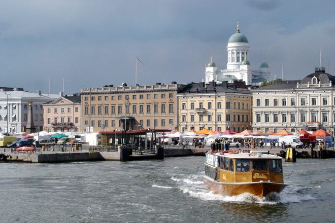Helsinki grew up around its busy harbor, overlooked by the gleaming white Lutheran Cathedral. [Contributed by Rick Steves]