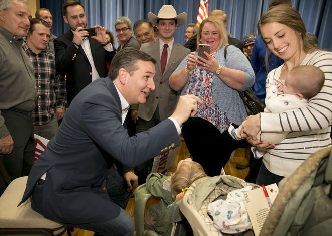 U.S. Sen. Ted Cruz, R-Texas, talks to supporter Alivia Parish and her 2-week-old son, Coleman Parish, at a rally in Sun City on Tuesday. [JAY JANNER/AMERICAN-STATESMAN]