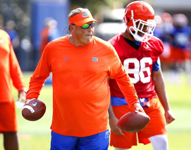 Florida defensive coordinator Todd Grantham leads a drill during a preseason drill in Gainesville, Fla. The former Georgia defensive coordiantor is remembered for giving a choke sign to Florida kicker Chas Henry at the end of Georgia's 2010 loss. [Brad McClenny/The Gainesville Sun]