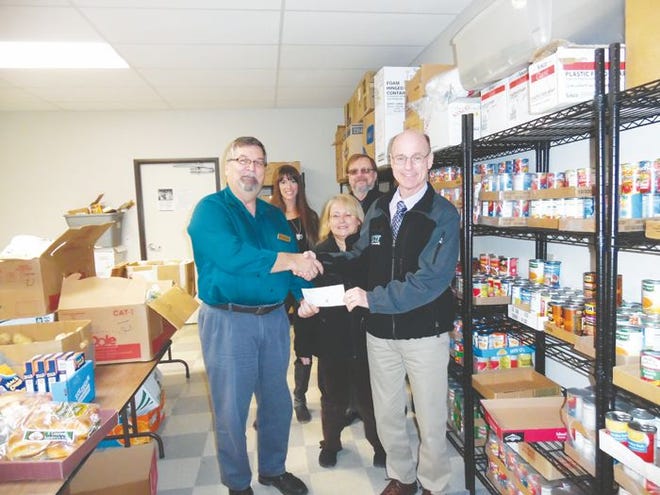 Members of EXIT Realty Premier presented Roman Hank, the Community Service Coordinator of the Salvation Army with a check for $500 to help with the annual canned food drive, which officially kicked off earlier this week.