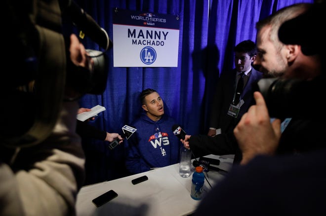 Los Angeles Dodgers' Manny Machado answers questions for the World Series baseball game Monday, Oct. 22, 2018, in Boston. The Dodgers play the Boston Red Sox in Game 1 of the World Series on Tuesday, Oct. 23, 2018. (AP Photo/Charles Krupa)