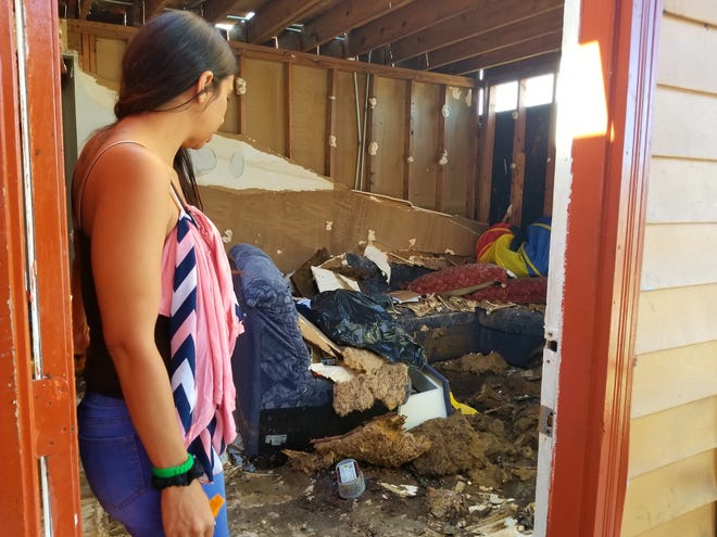 This is Rosa Perez's home in the Macedonia Garden Apartments in Panama City. She knows it is unsafe for her two children, but she is letting an acquaintance live there. All the residents of the complex have been ordered to vacate. With nowhere to go, about half are still living in squalor. [EILEEN KELLEY/FLORIDA TIMES-UNION]