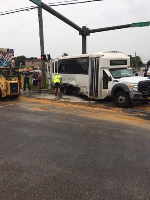 The passengers on this Okaloosa County transit bus were hospitalized with non-life-threatening injuries after the bus collided with a truck on Racetrack Road this morning. [OKALOOSA COUNTY SHERIFF'S OFFICE/CONTRIBUTED PHOTO]