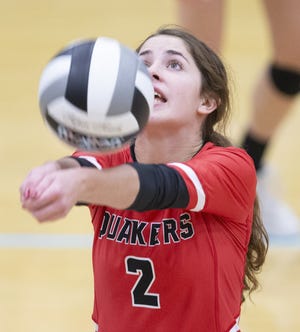 New Philadelphia's Carly Pry sets the ball against Perry in a Division I district semifinal tournament match at Alliance on Tuesday, Oct. 23, 2018. (CantonRep.com / Bob Rossiter)