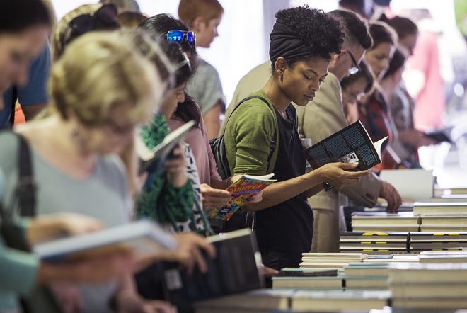 People browse books for sale during the Texas Book Festival 2017. [NICK WAGNER / AMERICAN-STATESMAN]