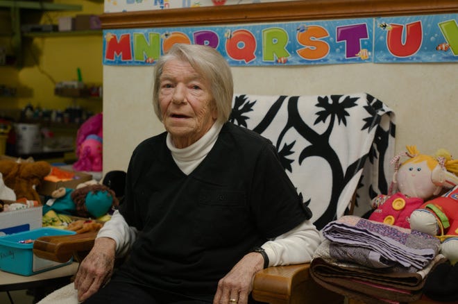 Kaye Elliott sits in the chair where she would watch children while running Aunt Kaye's Daycare on South N.C. Highway 150. The daycare closed Sept. 30 after 35 years. [Ben Coley/The Dispatch]