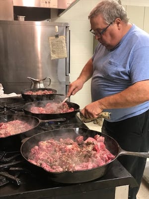 David Riggs, of Lincoln, prepares the meat that will be used in the vegetable soup lunch at Harvest of Talents Saturday at Lincoln Christian Church. Riggs said he serves on the Harvest committee and loves to cook. Soup will sell for $2.50 a bowl or $25 for a gallon. [Photo by Jean Ann Miller/The Courier]