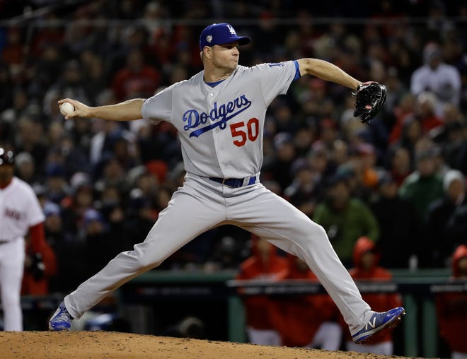 Los Angeles Dodgers' Ryan Madson throws during the fifth inning of Game 2 of the World Series baseball game against the Boston Red Sox Wednesday, Oct. 24, 2018, in Boston. (AP Photo/Matt Slocum)