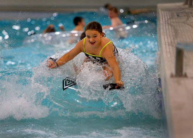 Kenadee Harmon plays in the wave pool at Splash! at Lively Park, in the Thurston area of Springfield, in this August 2015 photo. [The Register-Guard, file] - registerguard.com