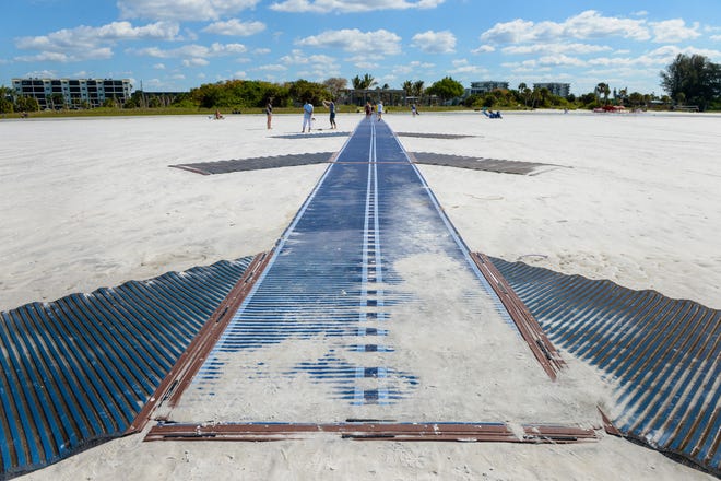 A Mobility Mat that allows easier wheelchair and walker access for visitors to Siesta Key Beach was cited in a recent report noting progress toward making Sarasota County more "age-friendly." [STAFF PHOTO / DAN WAGNER]