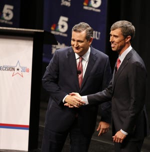 Republican U.S. Sen. Ted Cruz and Democratic U.S. Rep. Beto O'Rourke, who are vying for a seat in the U.S. Senate, shake hands in their first debate in Dallas on Sept. 21. [Nathan Hunsinger/The Dallas Morning News/TNS]