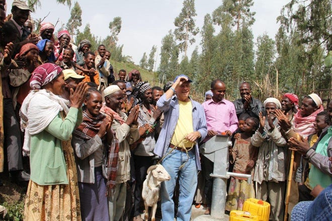 Water to Thrive founder Dick Moeller, center, is pictured here in Ethiopia. The organization raises money for clean-water projects in Africa. [AMERICAN-STATESMAN/HANDOUT PHOTO]