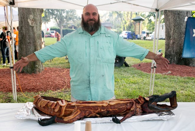 Bryan Reynolds presented his smoked, bacon-wrapped gator sponsored by Lake Eye at Beast Feast on Thursday. [Cindy Sharp/Correspondent]