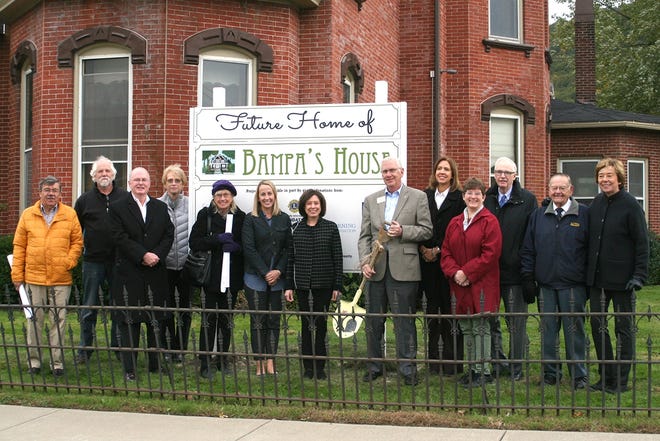 Bampa's House benefactors pose Thursday outside Bampa's House, located at 170 E. First St. in Corning. [SHAWN VARGO/THE LEADER]