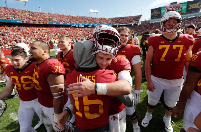 Iowa State quarterback Brock Purdy celebrates with teammate Keontae Jones after Saturday's 40-31 win over Texas Tech. [Charlie Neibergall/The Associated Press]