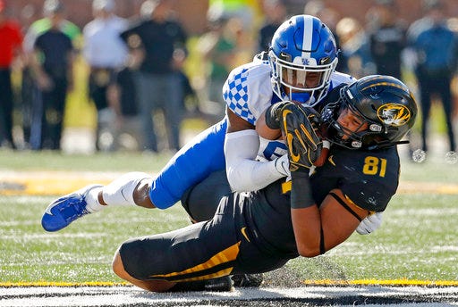 Missouri tight end Albert Okwuegbunam (81) is tackled by Kentucky cornerback Lonnie Johnson Jr. (6) during the first half of an NCAA college football game Saturday, Oct. 27, 2018, in Columbia, Mo. (AP Photo/Charlie Riedel)
