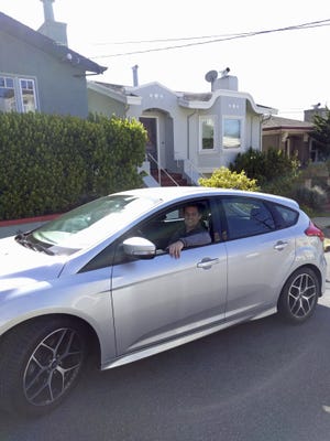 This 2017 photo shows Canvas' first subscriber, James O'Connor, sitting in his car from Canvas. If you already subscribe to digital services like Netflix to binge on TV shows and Spotify to groove to an endless mix of music, the auto industry might have a deal for you: Subscribe to your next car as well. Canvas offers a variety of used, once-leased Ford and Lincoln models as subscriptions that cost anywhere from $379 per month (for a Ford Fiesta subcompact) to $1,125 per month (for a Lincoln Navigator luxury SUV). (Chris Wai/Canvas via AP)