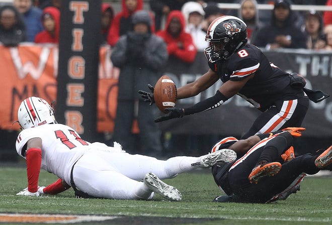 Massillon's Tyree Broyles comes up with a first half interception after it bounced out of McKinley's Jalen Ross and Massillon's Kyshad Macks hand in the first half. 

(IndeOnline.com / Kevin Whitlock)