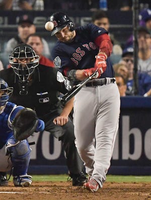 Boston's Steve Pearce hits a home run against the Los Angeles Dodgers during the eighth inning in Game 4 of the World Series on Saturday in Los Angeles. (AP Photo/Mark J. Terrill)