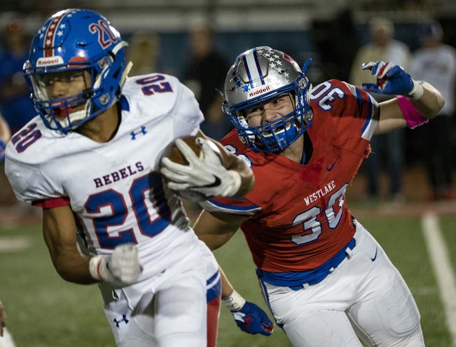 Westlake linebacker Blake Chambers chases Hays running back Xavier Green during the Chaparrals' 70-14 win Friday. Westlake remained No. 8 in this week's Associated Press state Top 10 poll. [Rodolfo Gonzalez/For American-Statesman]