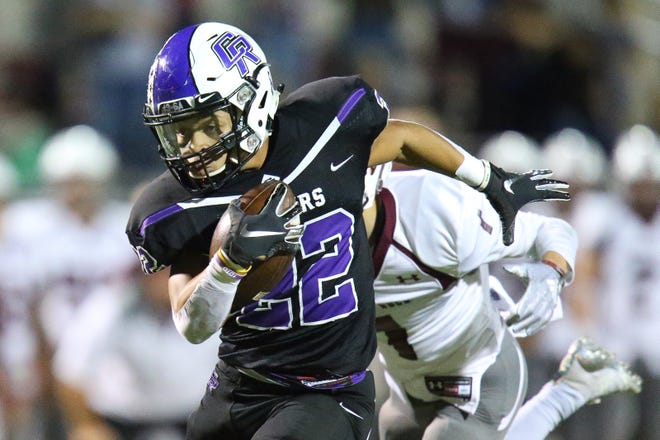 Cedar Ridge's Deuce Vaughn runs for a touchdown in the first half against Round Rock on Friday. The junior had 406 yards and four touchdowns on 32 carries in a 70-56 victory to win the Statesman's player of the week honors. [Lourdes Shoaf/For American-Statesman]