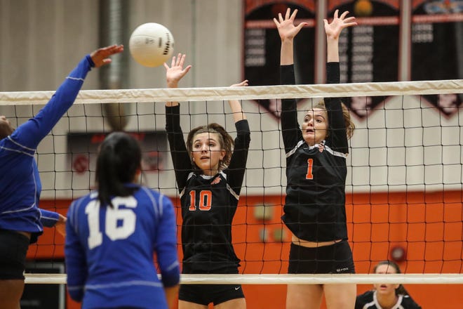 Anna Boone (1) and Rachel Fincher (10) are among Spruce Creek's top defenders at the net. The Hawks are matched up with heavy-hitting, nationally ranked Oviedo in the second round. [News-Journal/Lola Gomez]