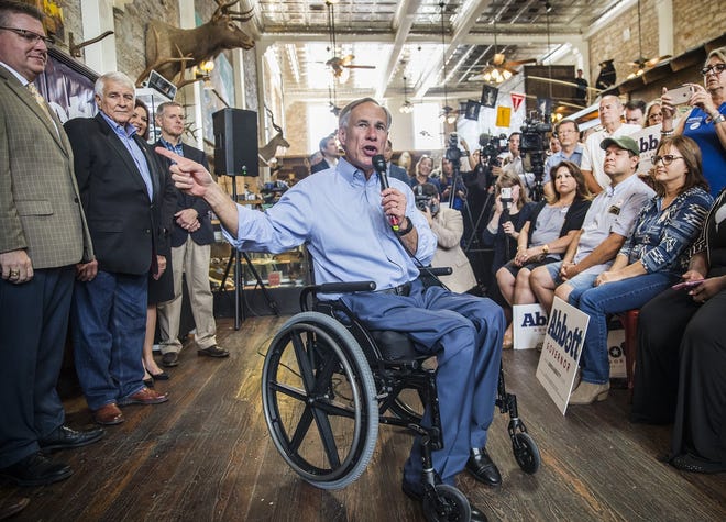 Gov. Greg Abbott speaks to a small group of supporters during a get-out-the-vote rally for himself and local Republican candidates at Mesquite Creek Oufitters in Georgetown on Tuesday. [RICARDO B. BRAZZIELL/AMERICAN-STATESMAN]