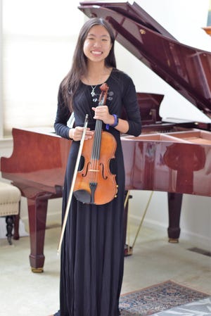 Moorestown Friends School sophomore Lauren Kam will practice and perform this year with the highly competitive Philadelphia Youth Orchestra. She has been playing viola for about five years. [COURTESY OF THE KAM FAMILY.]