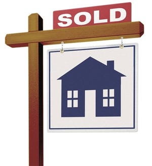 A realestate sign showing the house as sold on a white backgroun