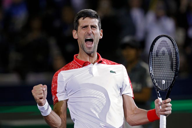 FILE - In this Sunday, Oct. 14, 2018 file photo, Novak Djokovic of Serbia celebrates after defeating Borna Coric of Croatia in their men's singles final match in the Shanghai Masters tennis tournament at Qizhong Forest Sports City Tennis Center in Shanghai, China. Djokovic is in electric form heading into the Paris Masters, where he is well poised to wrestle back the No. 1-ranking from longtime rival Rafael Nadal. (AP Photo/Andy Wong, File)
